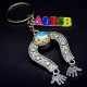 Keychain Lions made of metal in the form of a horseshoe (glass lens with a lion image inside) + color plate