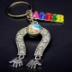 Keychain Lions made of metal in the form of a horseshoe (glass lens with a lion image inside) + color plate