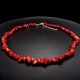 A set of beads and a bracelet on a fishing line with a lock made of natural stone Coral red