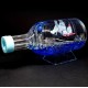 Souvenir table pen stand in the shape of a bottle with colored gel glitter and floating boats inside, size: 14,5*7,5*6 cm