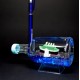 Souvenir table pen stand in the shape of a bottle with colored gel glitter and floating boats inside, size: 14,5*7,5*6 cm