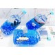 Souvenir table pen stand in the shape of a bottle with colored gel glitter and floating boats inside, size: 14,5*7,5*6 cm
