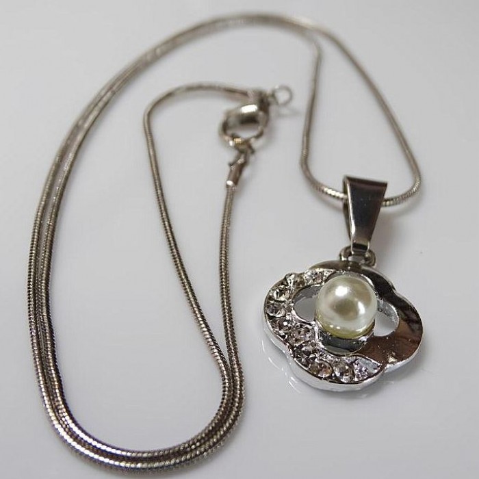 Pendant on a chain Clover with a pearl