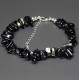 A set of beads and a bracelet on a fishing line with a lock made of natural stone black agate
