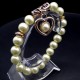 Elastic bracelet *Pearl* with one pendant, gold color, plastic material, pearl-like glass beads, ivory color, diameter: 10mm, size: 18.5cm+