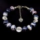 Glass beads bracelet. Diameter -12mm, color-black. The basis of the bracelet is a double strong fishing line with a lock, accessories - metal in silver, girth: 20cm+