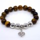 Bracelet on an elastic band made of natural stone "Tiger's eye" with a pendant, metal fittings in silver. Bead diameter: 10/10mm, girth: 19cm+