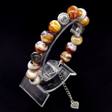 Glass beads bracelet. Diameter -12mm, color-brown. The basis of the bracelet is a double strong fishing line with a lock, accessories - metal in silver, girth: 20cm+
