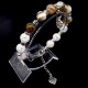 Bracelet made of natural stone "Onyx-Rock Crystal" with a pendant. Metallic thread, silver metal fittings. Bead diameter: 10mm, girth: 19.5cm+