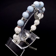 Bracelet made of natural stone *Blue Agate-Rock Crystal* with a pendant, the base is a metallized thread. Bead diameter: 10mm, girth: 19cm+