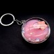 Keychain acrylic quicksand liquid in the form of a powder box inside the gel multi-colored floating figurines with sparkles. Size: diameter-5.5cm, thickness-2cm