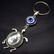 Keychain amulet Eye of Fatima in the form of a sea turtle, metal color silver, size: length-10cm, pendant-4.1/2.9cm