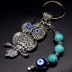 Keychain amulet of Fatima's eyes in the form of an owl with a pendant made of natural stones