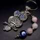 Keychain amulet of Fatima's eyes in the form of an owl with a pendant made of natural stones