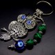 Keychain amulet of Fatima's eyes in the form of an owl with a pendant made of natural stones