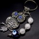 Keychain amulet of Fatima's eyes in the form of an owl with a pendant made of natural stones