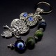 Keychain amulet of Fatima's eyes in the form of an owl with a pendant made of natural stones