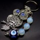 Keychain amulet of Fatima's eyes in the form of an owl with a pendant made of natural stones