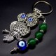 Keychain amulet of Fatima's eyes in the form of an owl with a pendant made of natural stones