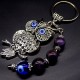 Keychain amulet of Fatima's eyes in the form of an owl with a pendant made of natural stones