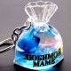 Acrylic water keychain in the form of a Bag with an inscription, inside the gel are multi-colored floating figurines with sparkles. Size: height-5.5cm, length-4.5cm