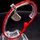 Bracelet red thread amulet against the evil eye with a pendant *shell scallop* metal color: silver, size: universal 12-19cm