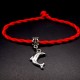 Bracelet red thread amulet against the evil eye with a pendant *Dolphin* metal color: silver, size: universal 12-19cm