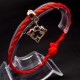 Bracelet red thread amulet against the evil eye with a pendant *Two Dolphins* plastic color: gold, size: universal 12-19cm