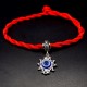 Bracelet red thread amulet against the evil eye with a pendant with rhinestones *Eye of Fatima* metal color: silver, size: universal 12-19cm