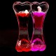 Hourglass antistress two-color oil in the form of a double heart inside the colored gel and multi-colored floating fish