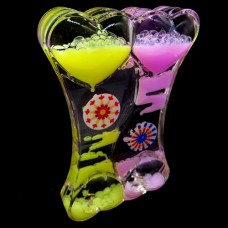Hourglass antistress two-color oil in the form of a double heart inside a colored gel and multi-colored floating fish. Size: 14*9cm