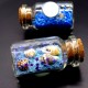 Glass bottle size: height 4cm, diameter 2.2cm, inside colored sand with sparkles and natural shell.