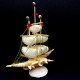 Sea souvenir from a shell in the form of a sailboat