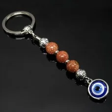 Keychain Talisman amulet made of natural stone Aventurine golden sand.