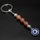 Keychain Talisman amulet made of natural stone Aventurine golden sand.