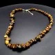 A set of beads and a bracelet on a fishing line with a lock made of natural stone Carnelian