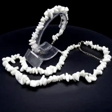 A set of beads and a bracelet on a fishing line with a lock made of natural stone Agate white