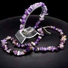 A set of beads and a bracelet on a fishing line with a lock made of natural stone Amethyst