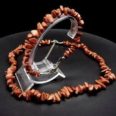 A set of beads and a bracelet on a fishing line with a lock made of natural stone Aventurine
