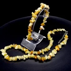 A set of beads and a bracelet on a fishing line with a lock made of natural Citrine stone
