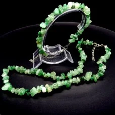 A set of beads and a bracelet on a fishing line with a lock made of natural stone Nephrite