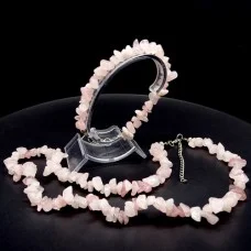 A set of beads and a bracelet on a fishing line with a lock made of natural stone Rose quartz
