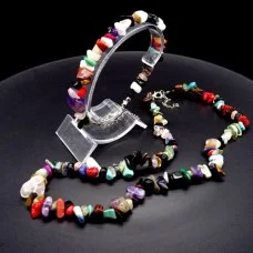A set of beads and a bracelet on a fishing line with a lock made of natural stone Gems