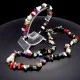 A set of beads and a bracelet on a fishing line with a lock made of natural stone Gems