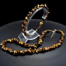 A set of beads and a bracelet on a fishing line with a lock made of natural stone Tiger's eye