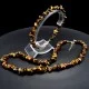 A set of beads and a bracelet on a fishing line with a lock made of natural stone Carnelian