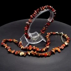 A set of beads and a bracelet on a fishing line with a lock made of natural stone Jasper brown
