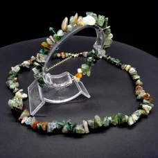 A set of beads and a bracelet on a fishing line with a lock made of natural stone Jasper green