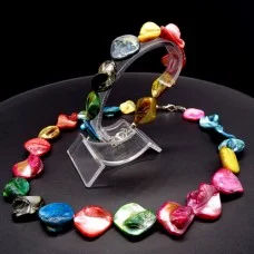 A set of beads and a bracelet made of natural mother-of-pearl shells