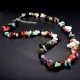 A set of beads and a bracelet on a fishing line with a lock made of natural stone Gems
